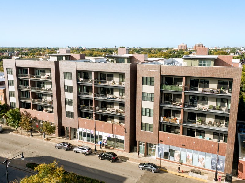 Mid-rise residential building with ground-floor retail