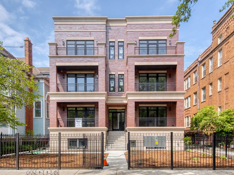 Newer masonry apartment building with balconies
